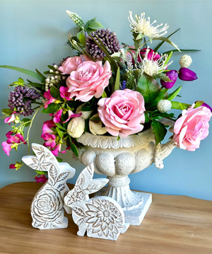faux flower arrangement with peonies & other flowers in a concrete-look vase